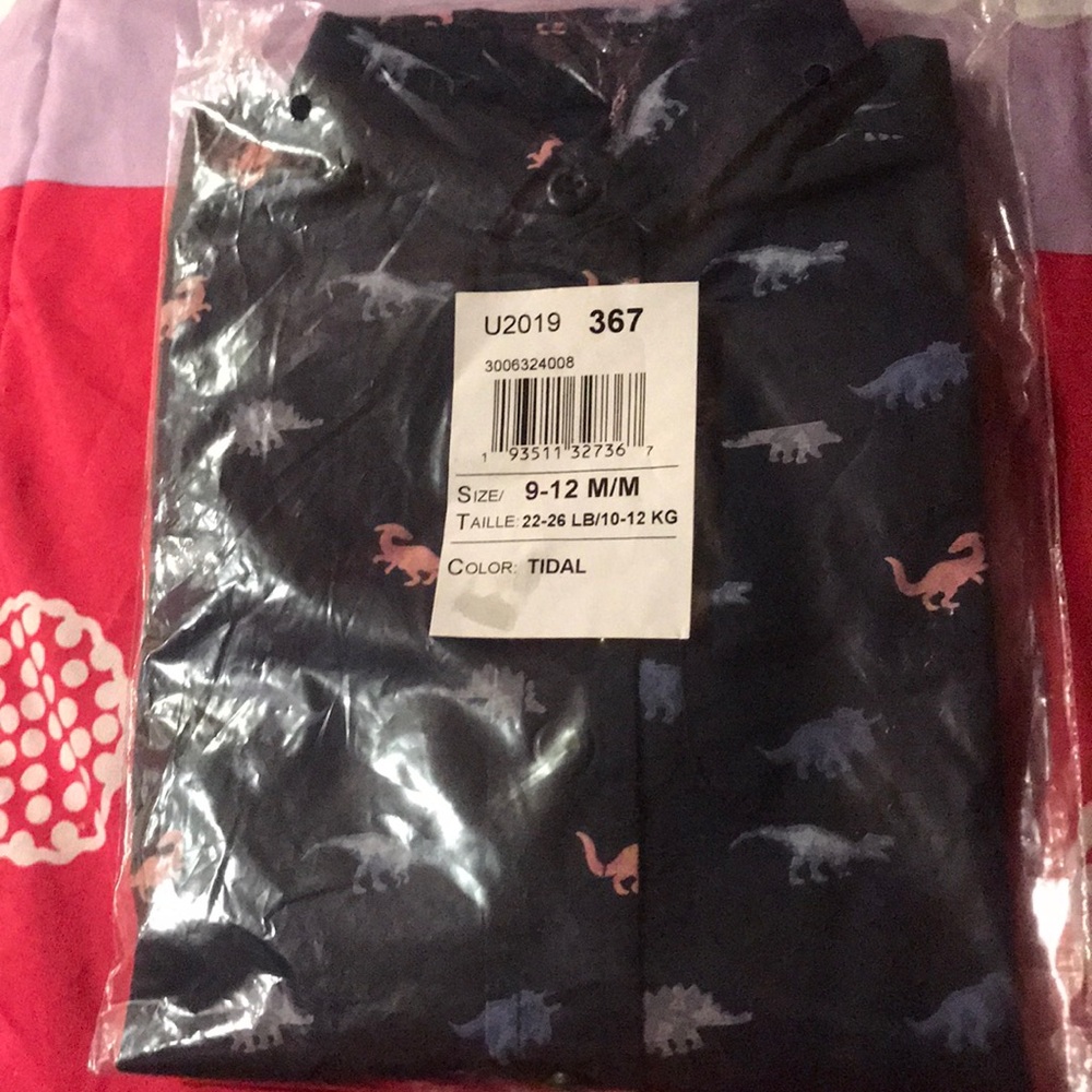 Brand new . Still in plastic button up shirt 👕
